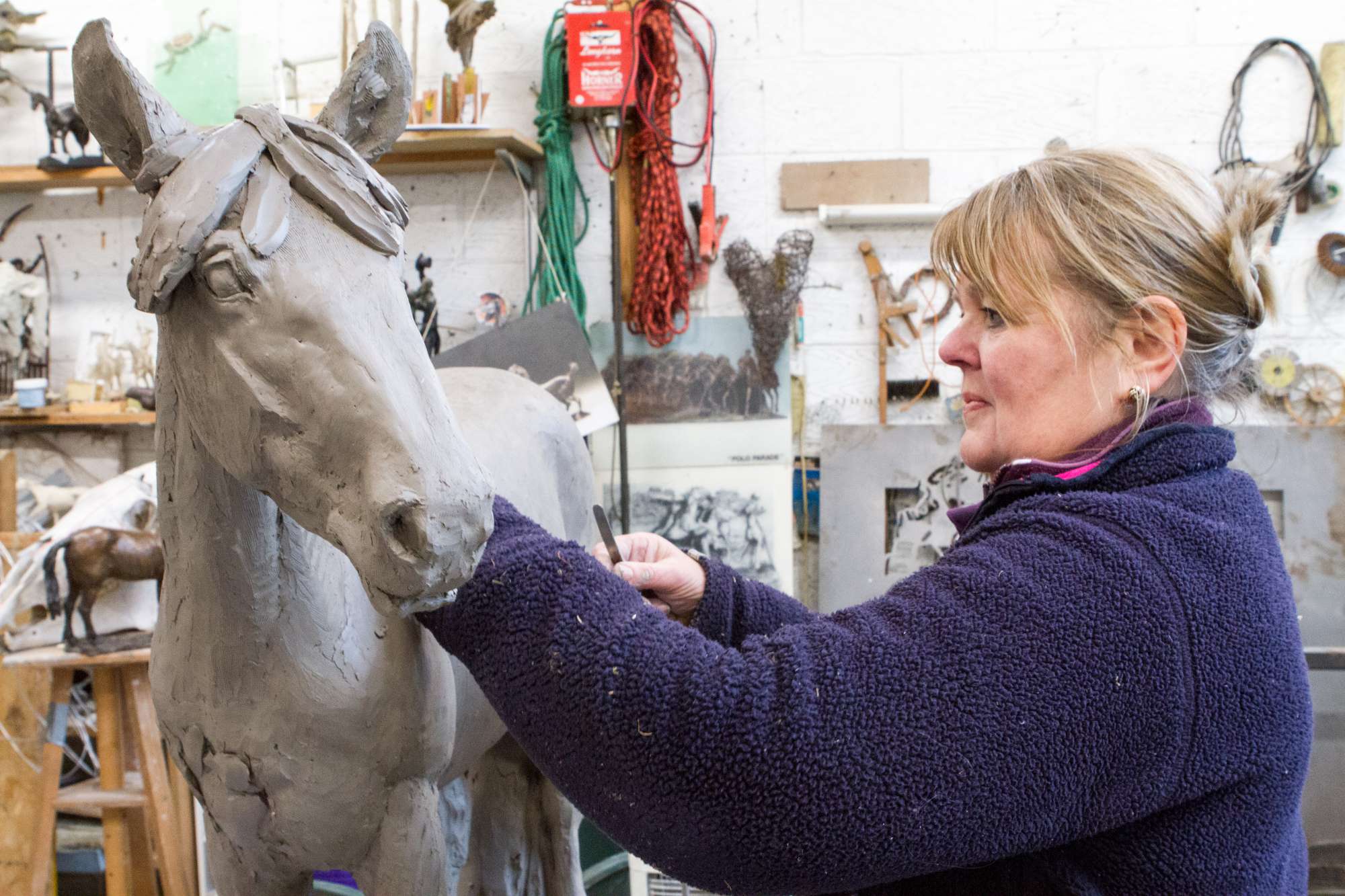 Judy Boyt crafting the clay maquette of World Horse Welfare May